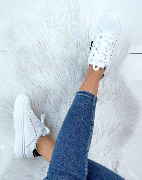 White studded sneaker with black inserts
