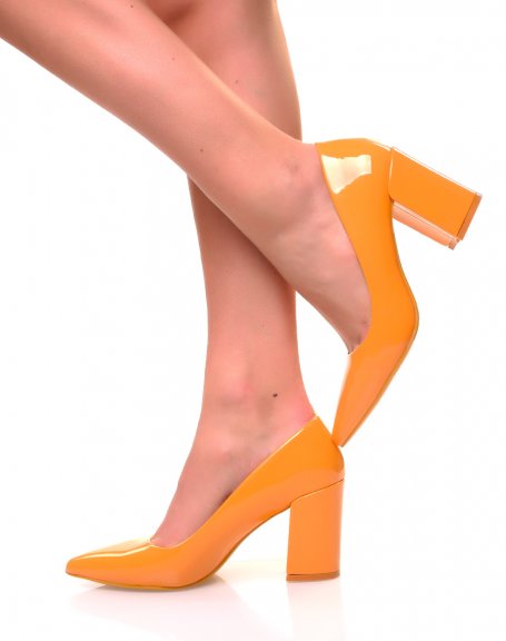 Yellow patent pumps with square heels and pointed toes