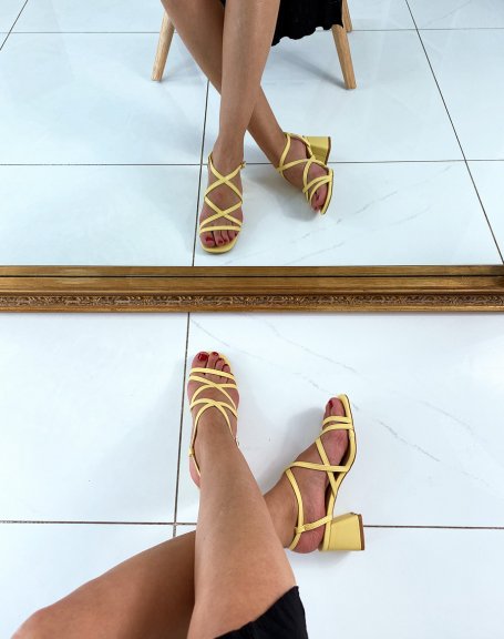 Yellow sandals with multiple crossed straps