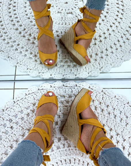 Yellow suede wedges with crisscrossed laces