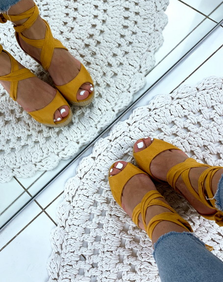 Yellow suede wedges with crisscrossed laces