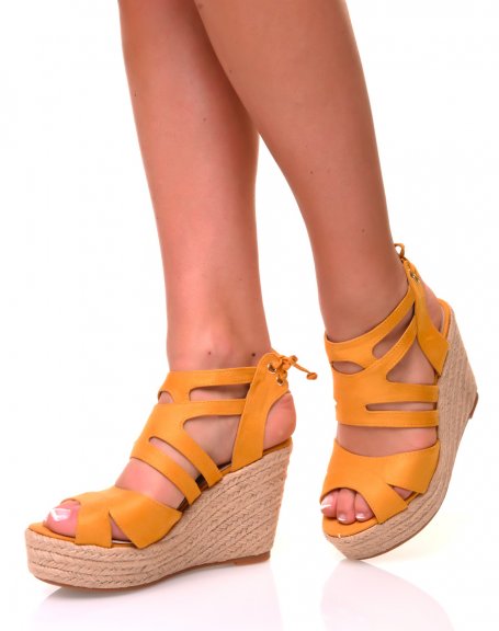 Yellow suedette sandals with wedge heels