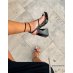 Black patent sandals with toe loop and imposing heel