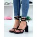 Black sandals with rectangular heels and square toes