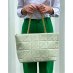 Green quilted handbag with golden chain