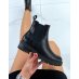 Low black ankle boots with croc effect
