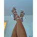 White sandals with square heels and thin crisscrossing straps